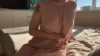 A Dainty Girl In A Pink Dress Indulges In Self-Pleasure
